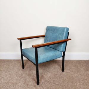 Blue mid century armchair facing left distant