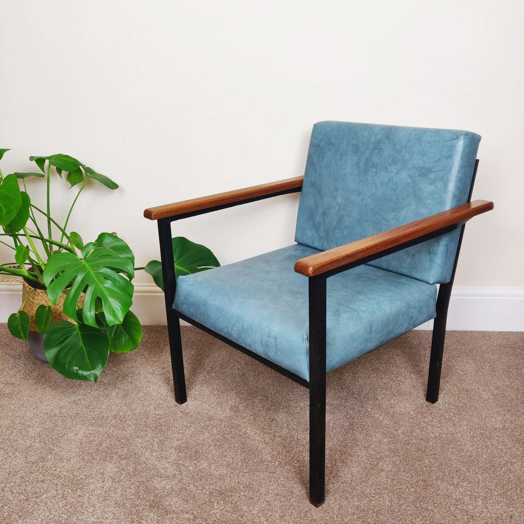 Blue mid century armchair facing left